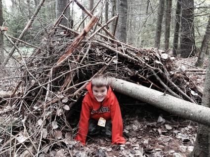 A child in a shelter he built