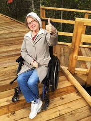Wheelchair accessible boardwalk user
